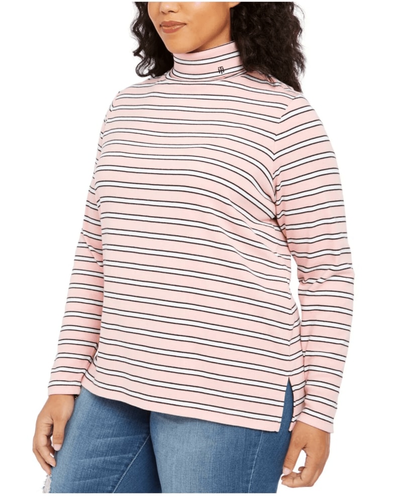 Front of a model wearing a size 1X Tommy Hilfiger Women's Plus Striped Turtleneck Top Pink Size 1X in Pink by Tommy Hilfiger. | dia_product_style_image_id:311520